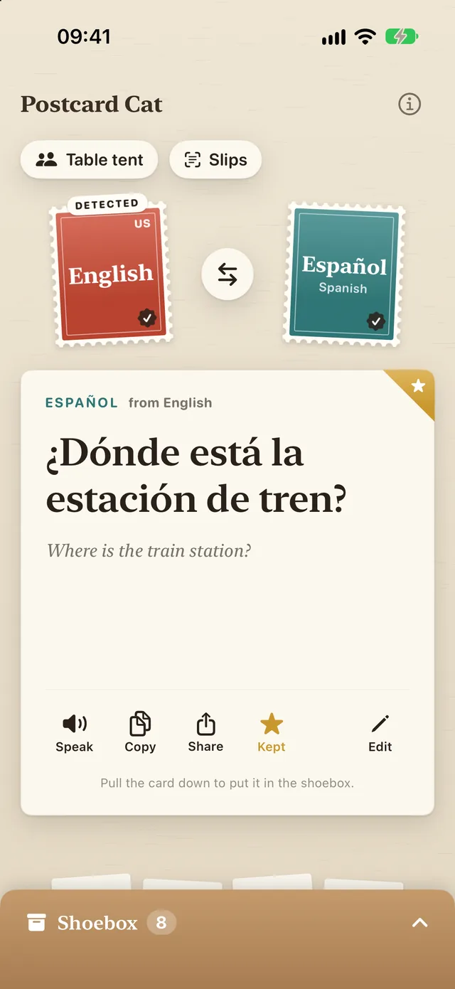 Postcard Cat: a card turned over, showing "¿Dónde está la estación de tren?" above the English "Where is the train station?", with Speak, Copy, Share, Kept and Edit, and the shoebox below
